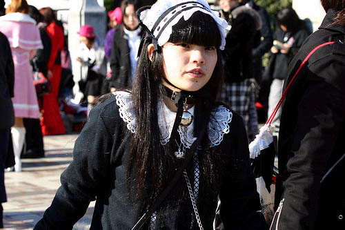 Gothic Lolita on Harajuku Bridge in Tokyo Japan, home of J-rock fashion.