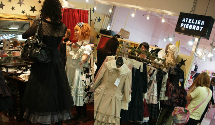 Atelier Pierrot gothic and sweet lolita store in Laforet, with brands Victorian Maiden, Innocent World, Beth, little hats and lace accessories. Tall male gosurori.