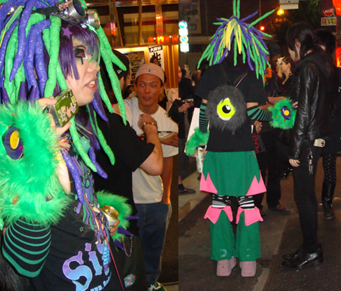 DJ Sisen, Japanese Cyber Goth deejay wearing Takuya Angel, crazy monsters inc hand and kid's backpack, tall pink platform shoes at Tokyo Dark Castle.