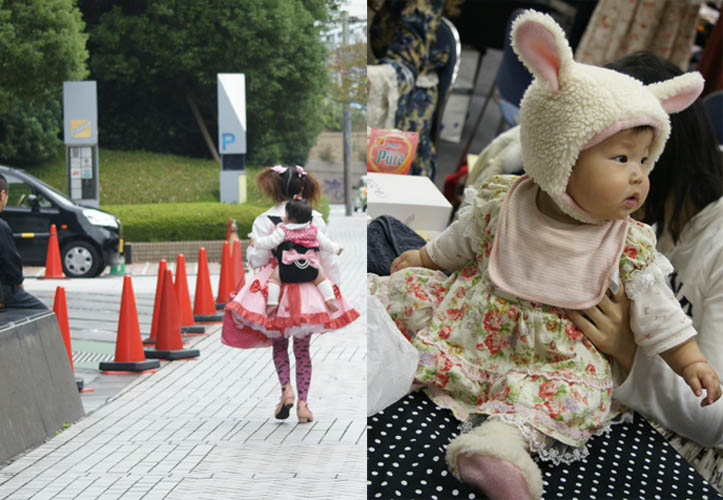 Baby lolitas, little toddler kid in bunny ears costume. Japanese girl carrying baby on back, dressed in crazy outfit. Alamode Market, Gothic Lolita shopping and small designer boutiques, presented by D's Valentine in Tokyo Japan.