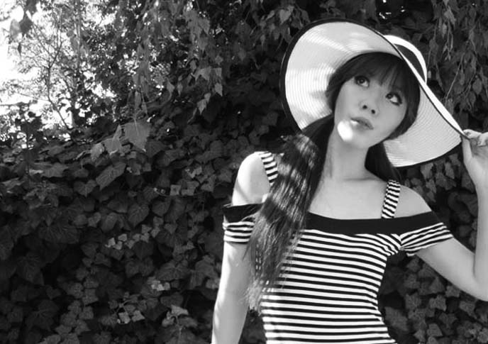 black white striped shirt, sun hat