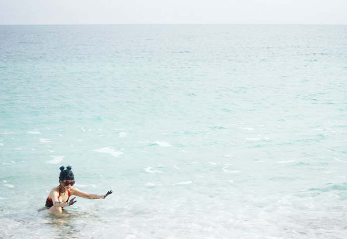 girl floating in dead sea water