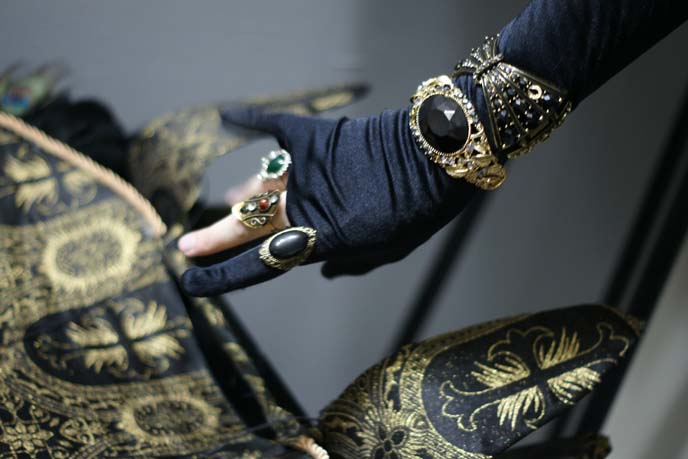 gold bracelets, rings on hand