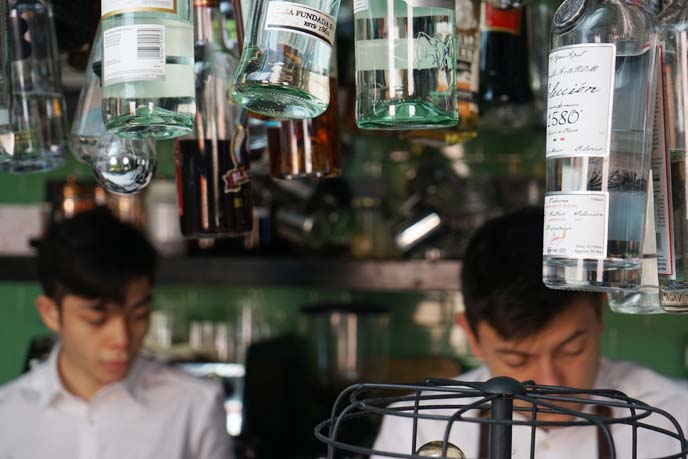 hanging bottles bar, bartenders