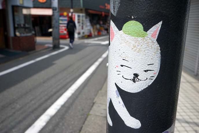 gotokuji cat art poles