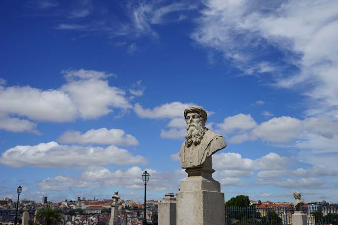 lisbon clouds blue sky, sculptures