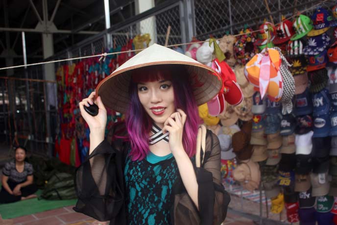 girl wearing vietnamese pointed hat