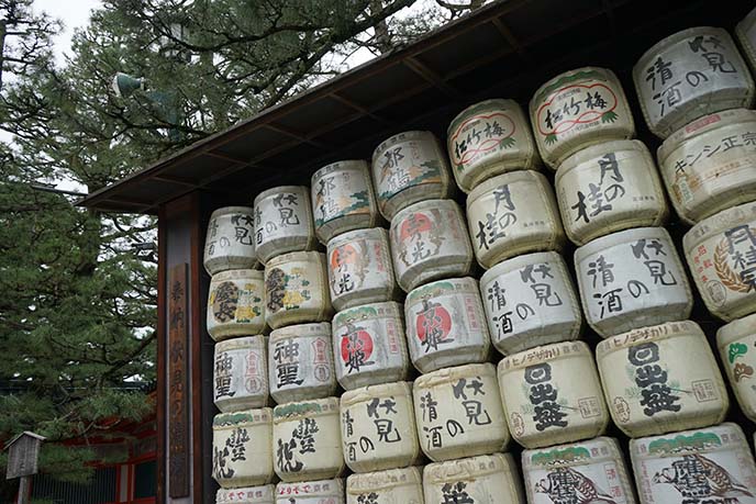 sake barrels in front of shrines, japan