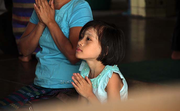 praying burmese girl child