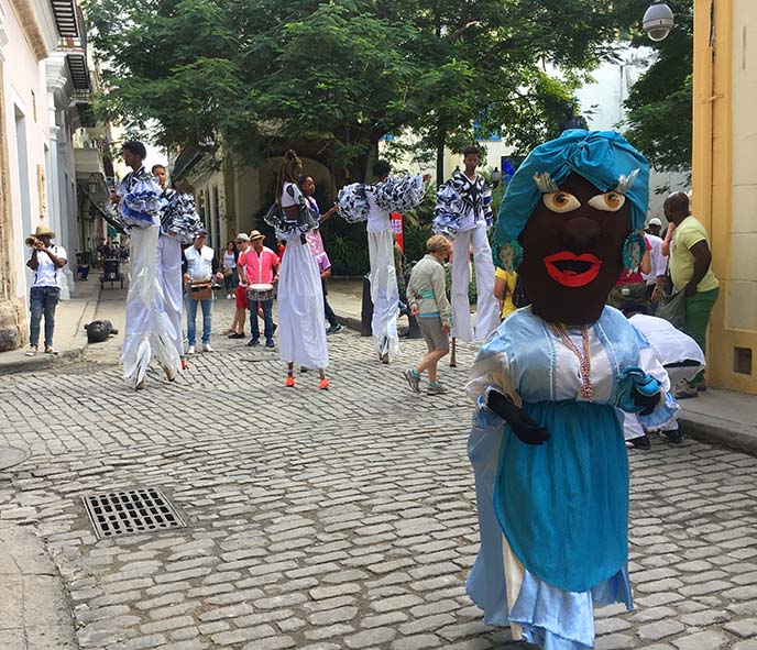 havana festival parade stilt walkers