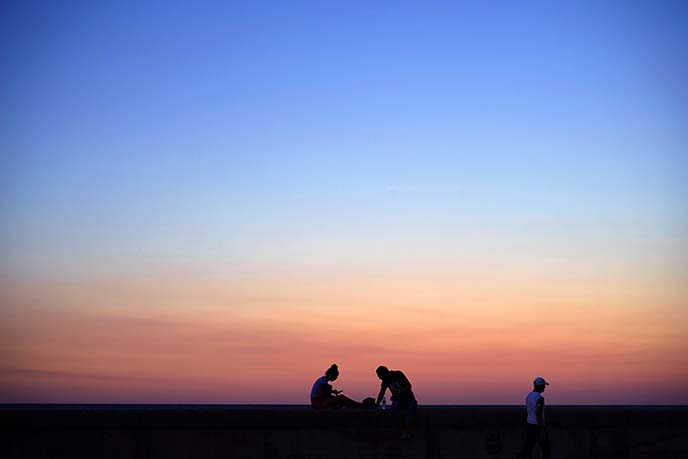 sunset silhouette havana cuba seawall