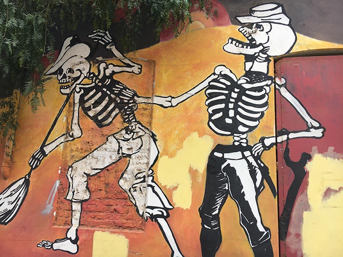 laughing skeletons mural