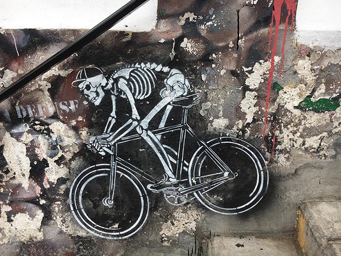 bicycling skeleton graffiti