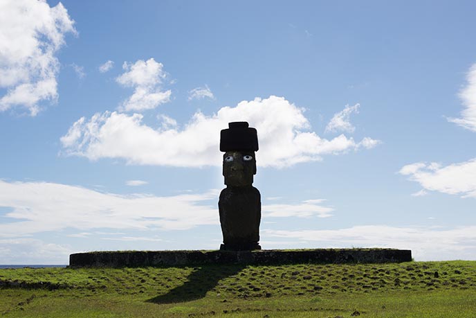 moai with eyes wearing hat