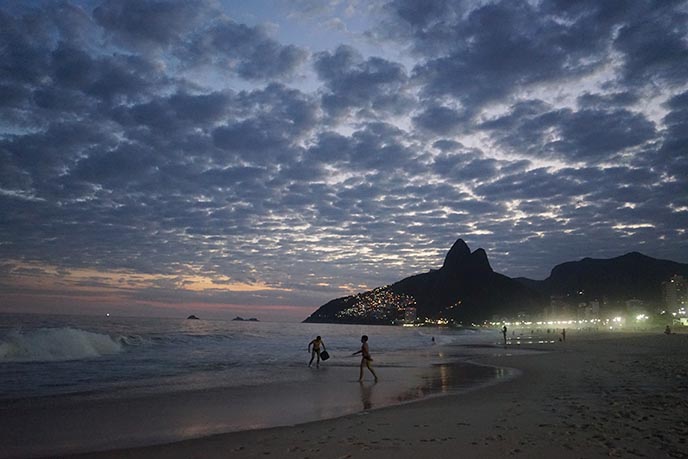 sunset ipanema beach mountains