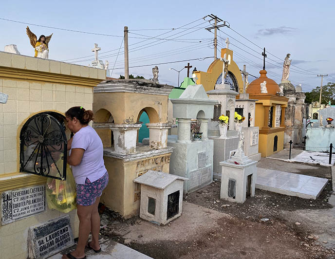 mexicans cleaning graves tombs