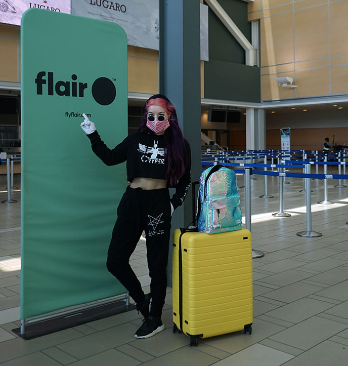 yellow away luggage, flair airlines travel influencer instagrammer canada