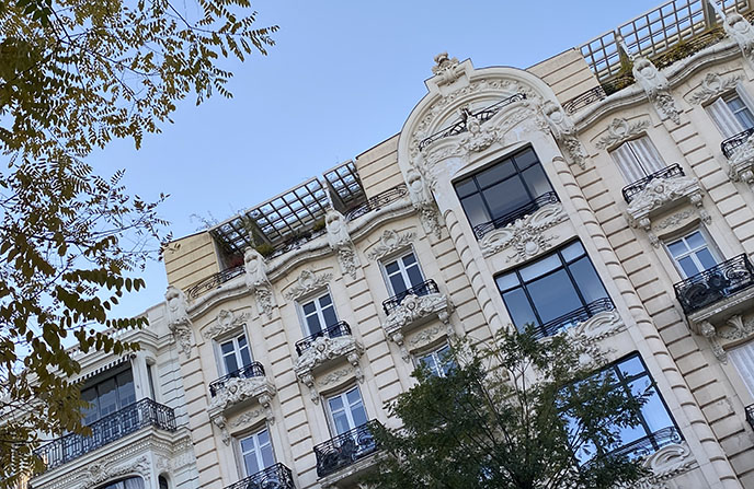 madrid classic architecture sculpted building facade carved faces