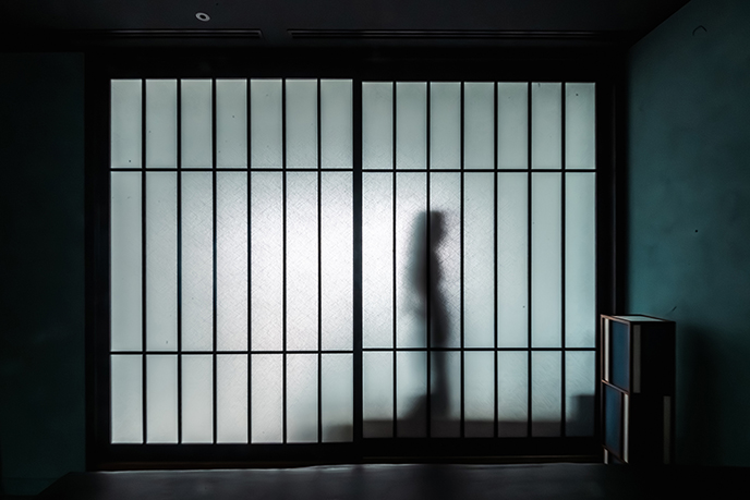shoji screen woman walking behind japanese